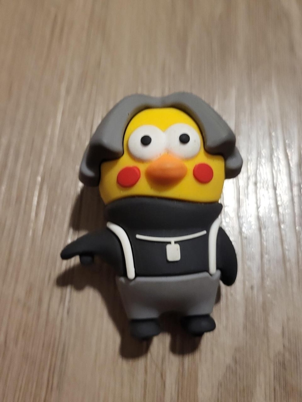 Yellow Cartoon Character Figure with Gray Hair